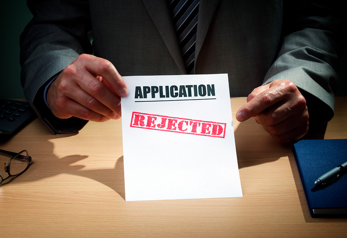 Manager holding an application rejection letter