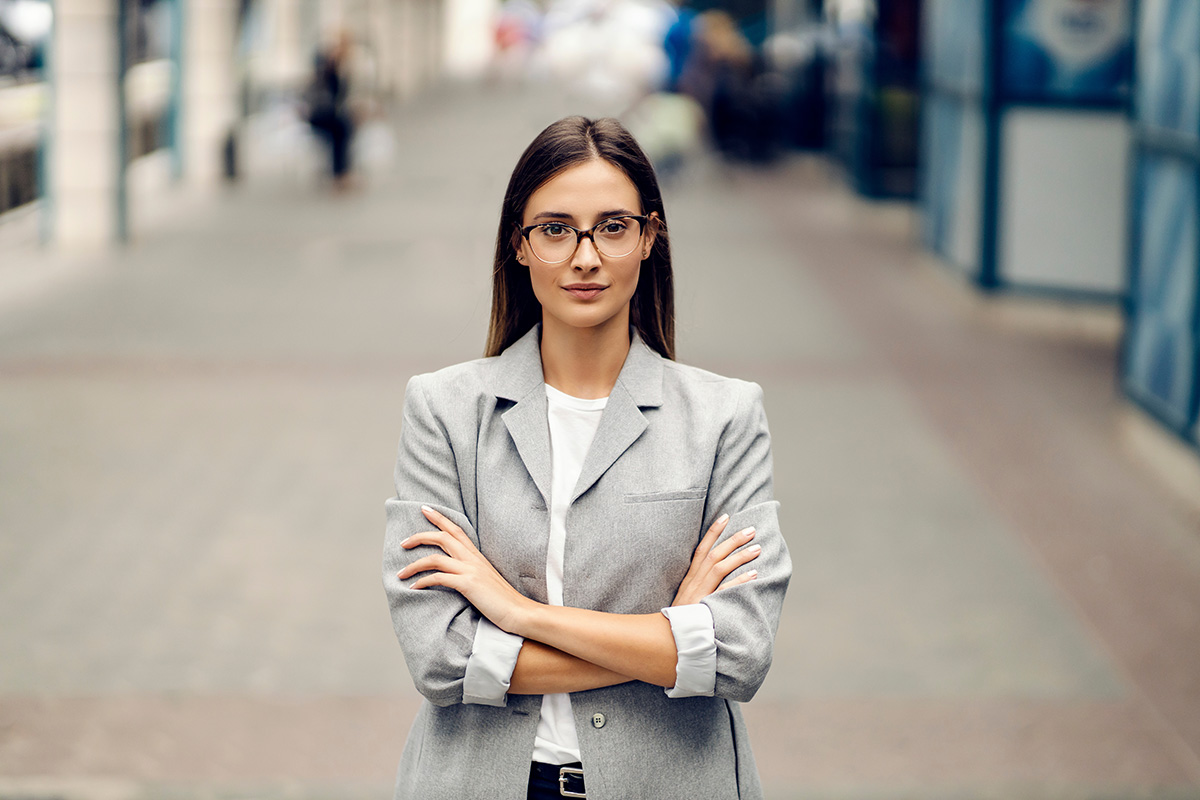 Office woman standing with arms crossed